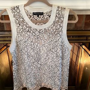 White Laced with black outlines floral top.